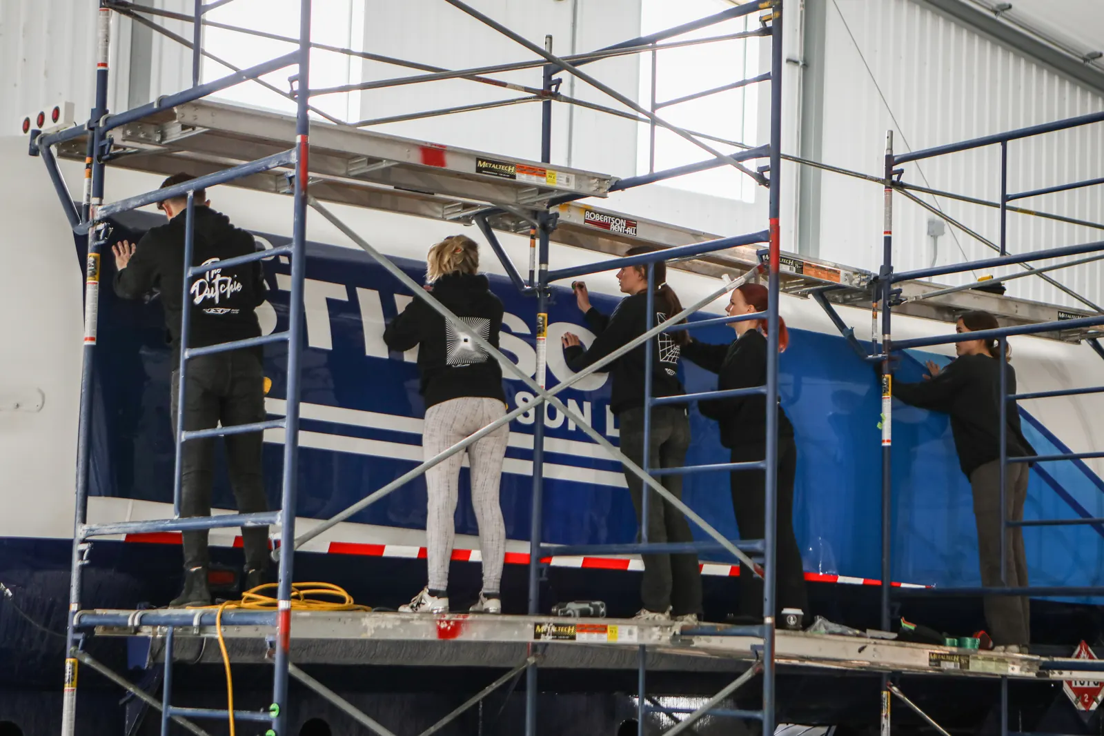 The VSF Wrap team wrapping a WO Stinson propane tanker