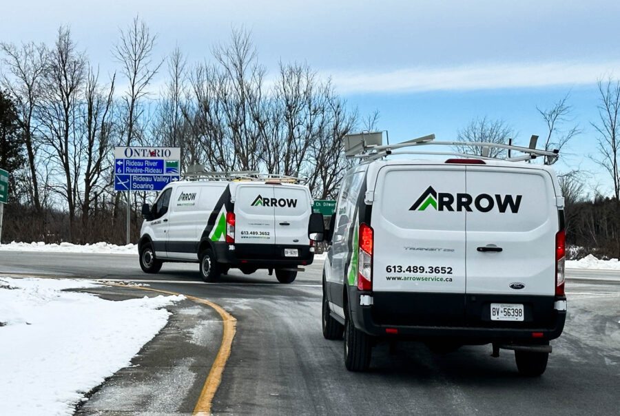 A fleet of Ford Transit wraps for Arrow in Ottawa, designed to enhance brand visibility across multiple service vehicles.
