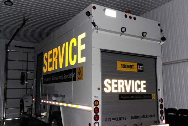 A reflective lube truck wrap for CAT Toromont in Ottawa, designed for high visibility and a sleek commercial finish.