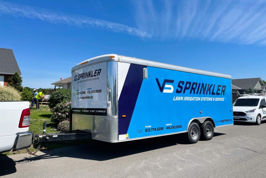 A high-visibility sprinkler trailer wrap for VS Landscape Group in Ottawa, ensuring a strong branded presence on the road.