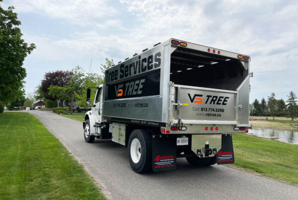 A bold and highly visible chipper truck wrap for VS Landscape Group in Ottawa, designed to maximize brand exposure on job sites.