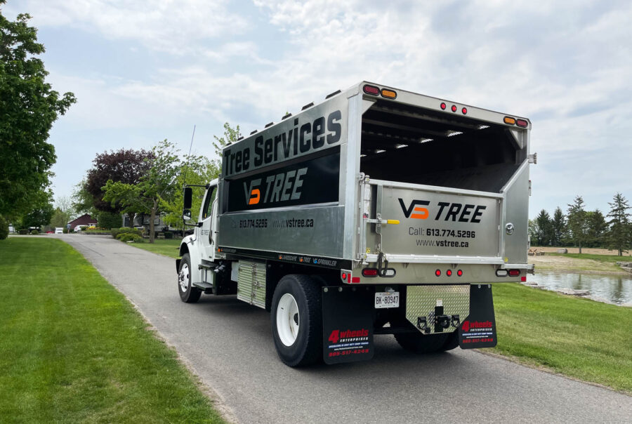 A bold and highly visible chipper truck wrap for VS Landscape Group in Ottawa, designed to maximize brand exposure on job sites.