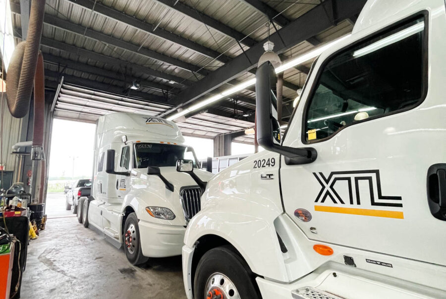 A lineup of custom commercial truck wraps for XTL Transport in Ottawa, ensuring strong visibility on highways and job sites.