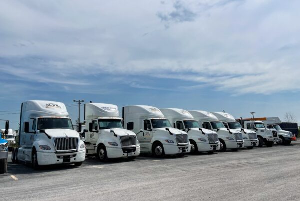 A lineup of custom commercial truck wraps for XTL Transport in Ottawa, ensuring strong visibility on highways and job sites.
