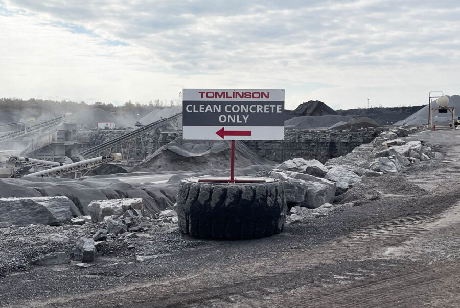 Clear concrete signage with arrow magnet designed for Tomlinson by VSF Wrap in Ottawa
